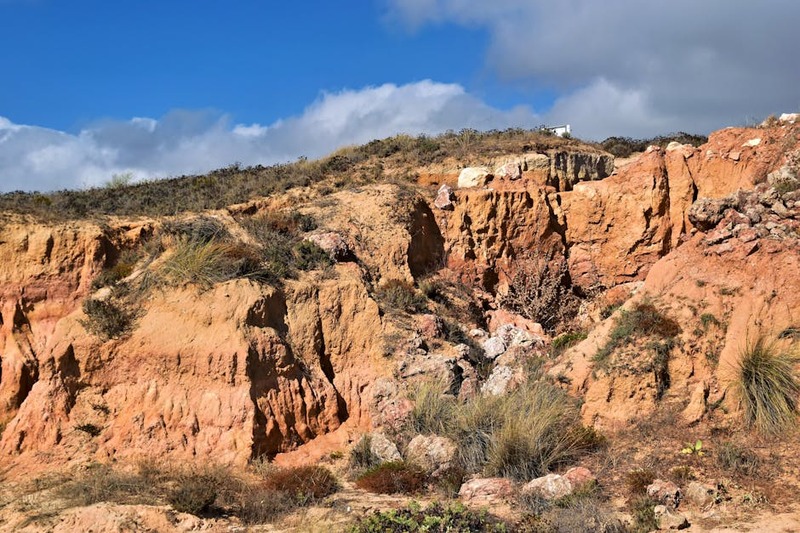 Beautiful rock formations in Guia, Faro, Portugal under a clear blue sky.